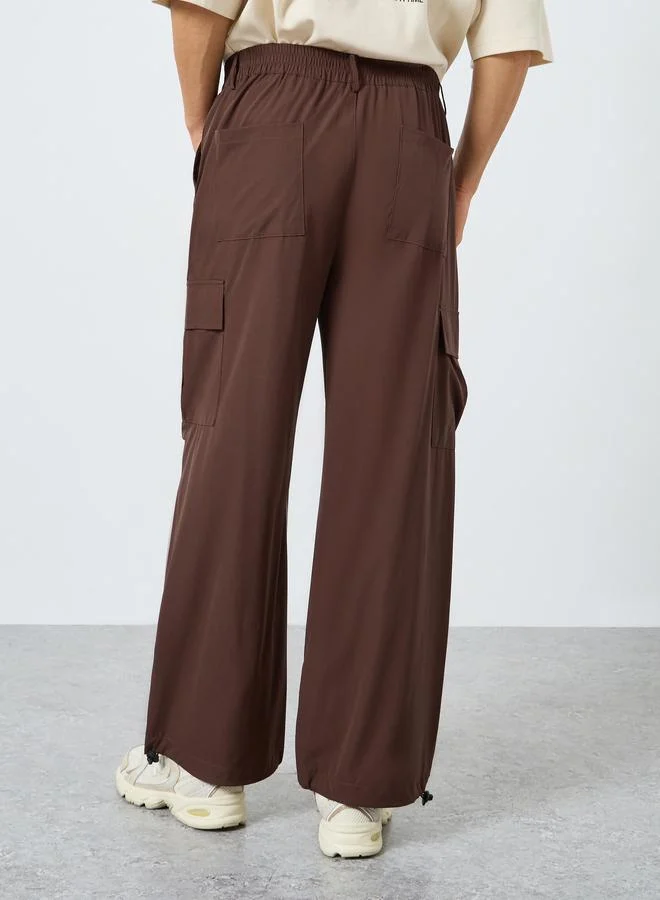 Styli  Men Oversized Front Pleat Cargo Pants for Men | Best Price UAE